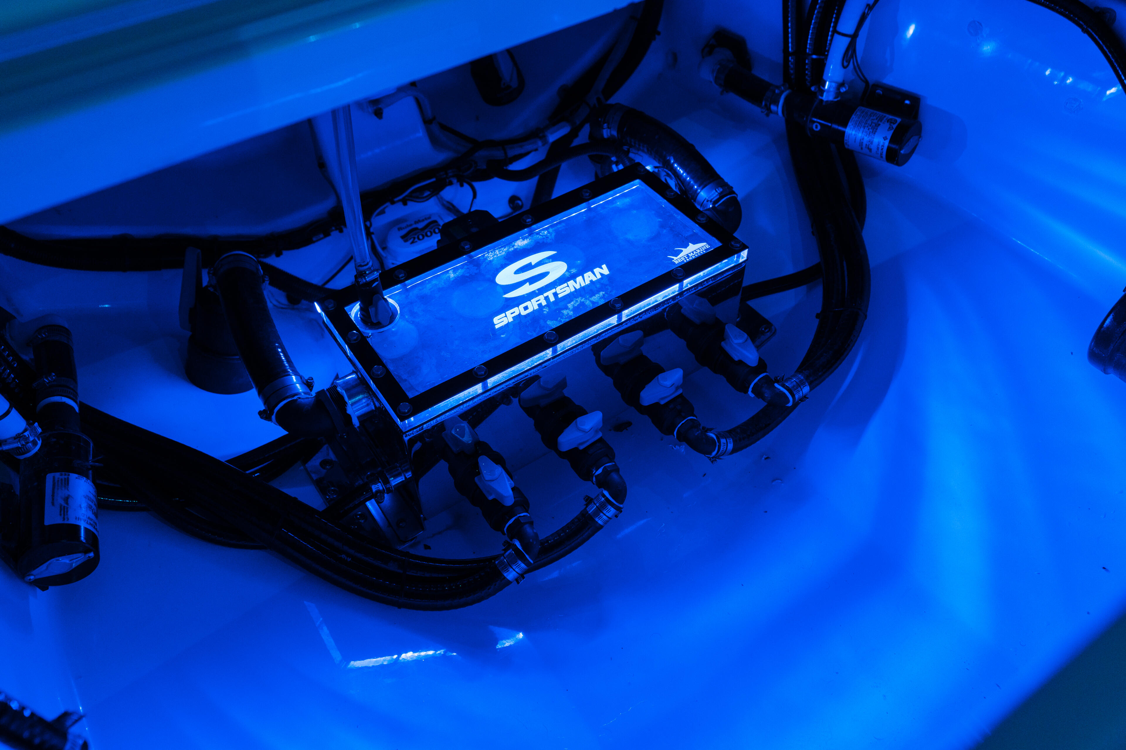 Sportsman boat's helm console illuminated with bright blue LED lighting and control systems