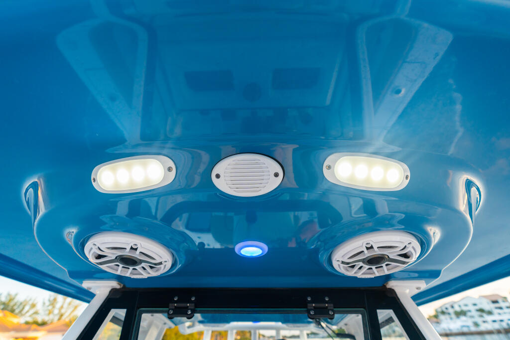 Hard-top interior ceiling with LED lighting, speakers, and ventilation system installed