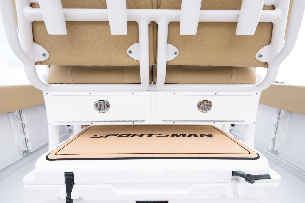 Overhead view of Sportsman center console cabin showing tan upholstered seating and white cabinetry with storage drawers