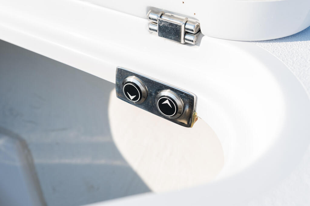 Dual flush-mounted air vents with chrome trim on white boat cabin exterior