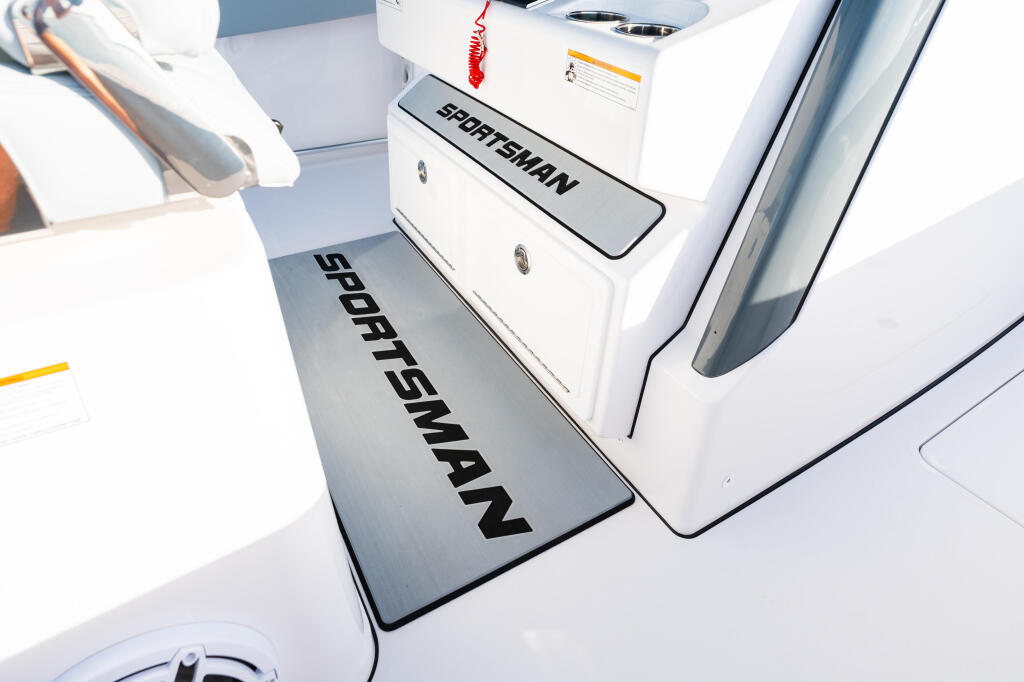 Sportsman branding on boat console and deck in bright sunlight