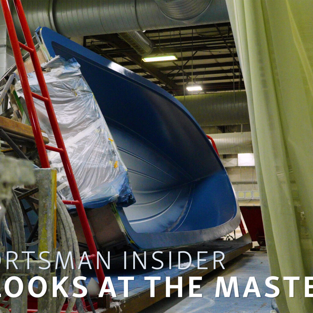 Masters 288 boat undergoing construction in a warehouse facility with protective wrapping
