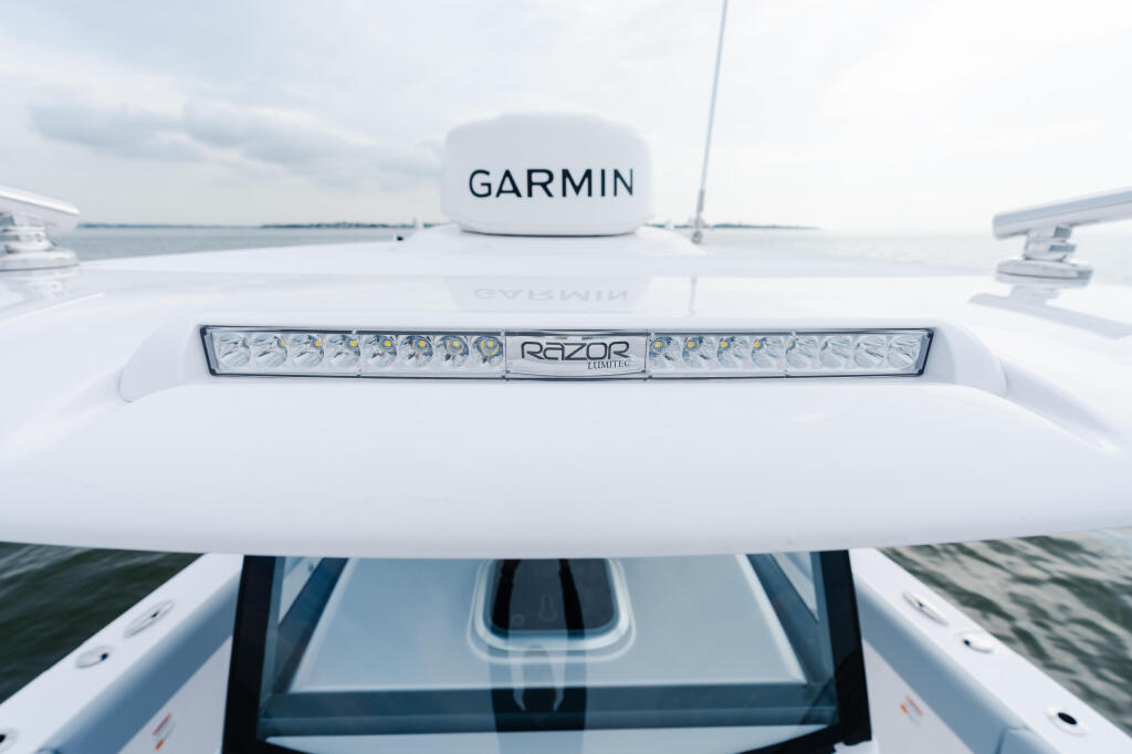 Garmin radar dome and Razor LED lighting bar mounted on the hardtop of a fishing boat