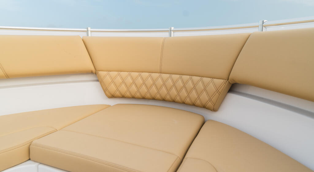 Tan leather seating with quilted backrest details aboard a boat