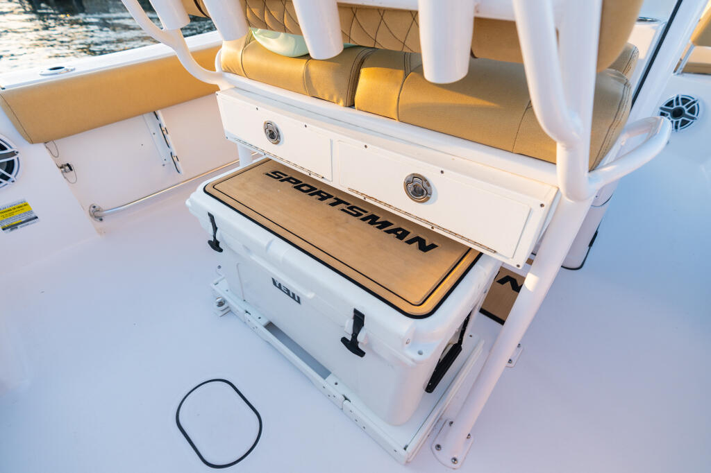 Sportsman cooler with tan cushioned seating and white hardtop frame in center console cockpit