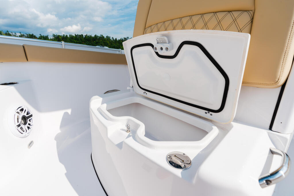Open livewell with white lid and black gasket on center console boat