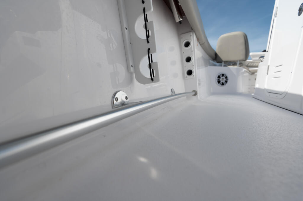 Close-up of the port side deck and gunwale railing on a center console boat