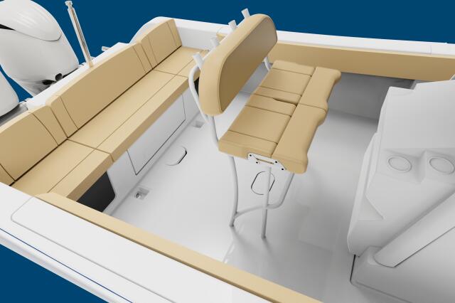 Overhead view of center console boat showing tan upholstered seating, helm station, and white cabin structure