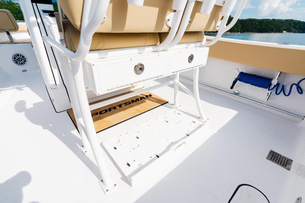 Open transom galley with built-in storage and Boatsman mat on fishing boat docked at lake