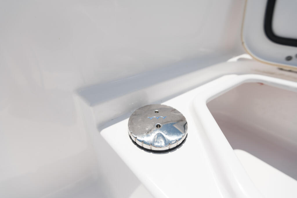 Chrome freshwater washdown valve mounted on white boat console