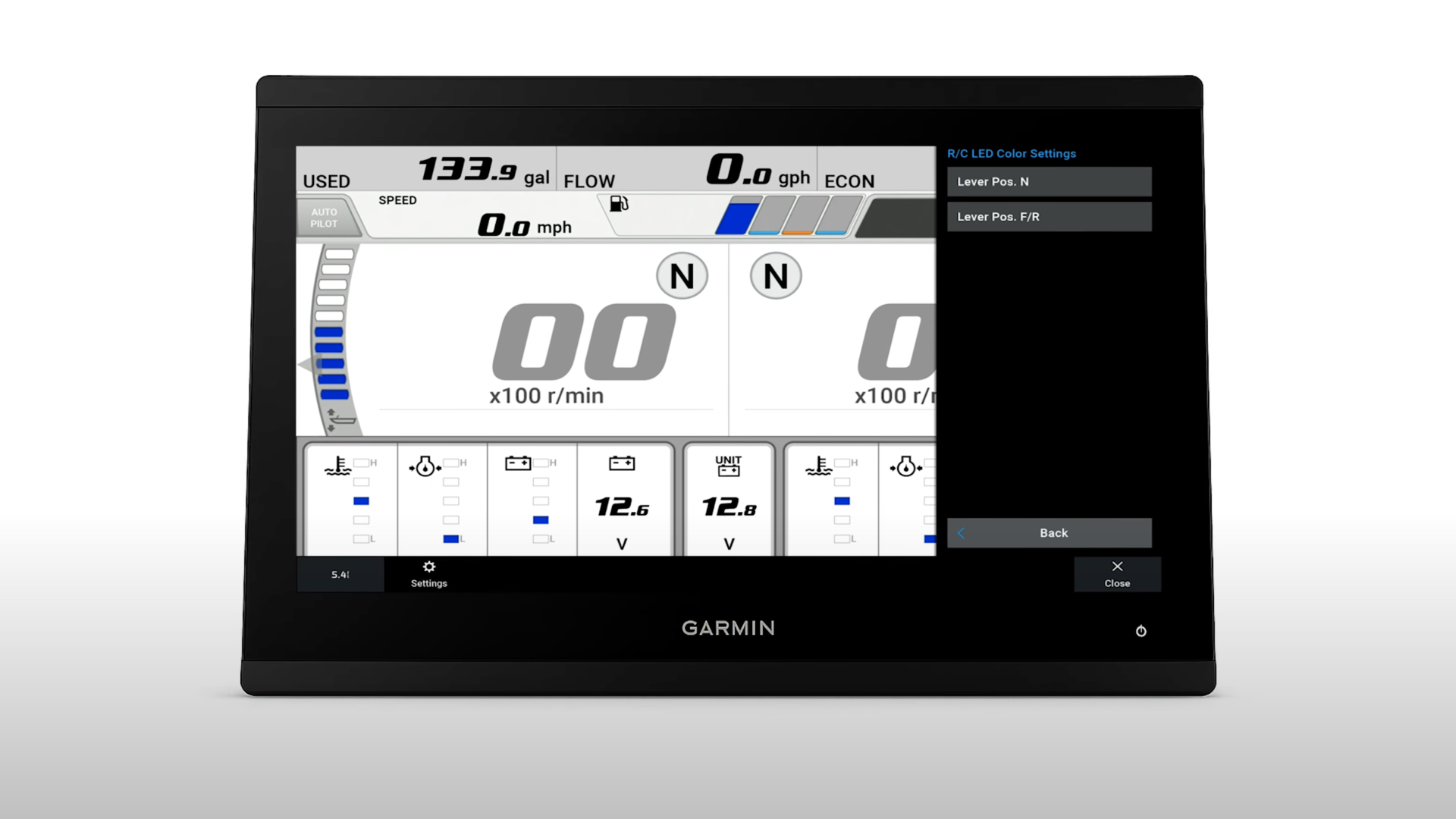 Garmin marine GPS display showing fuel consumption, engine RPM, and voltage readings at idle