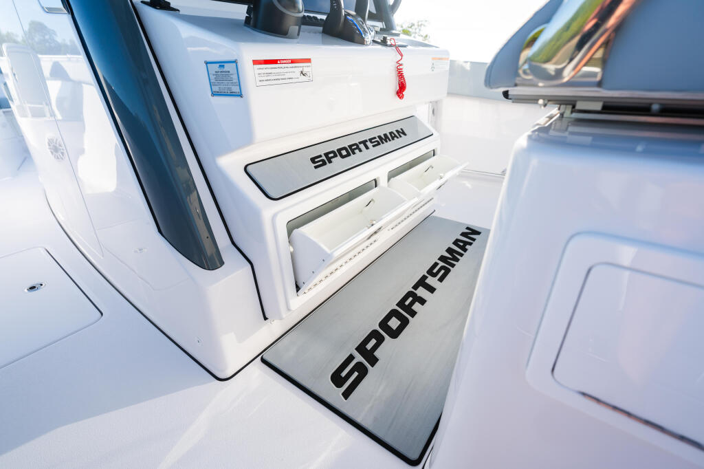 Sportsman boat stern with open storage compartments and branded non-slip deck matting