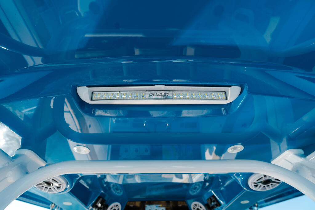 LED lighting strip mounted on the blue hard-top interior of a boat