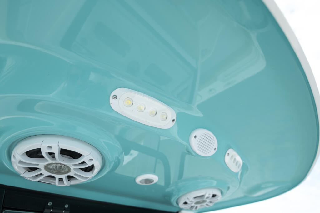 Hard-top interior with LED spreader lights, ventilation, and cabin exhaust outlets in turquoise finish
