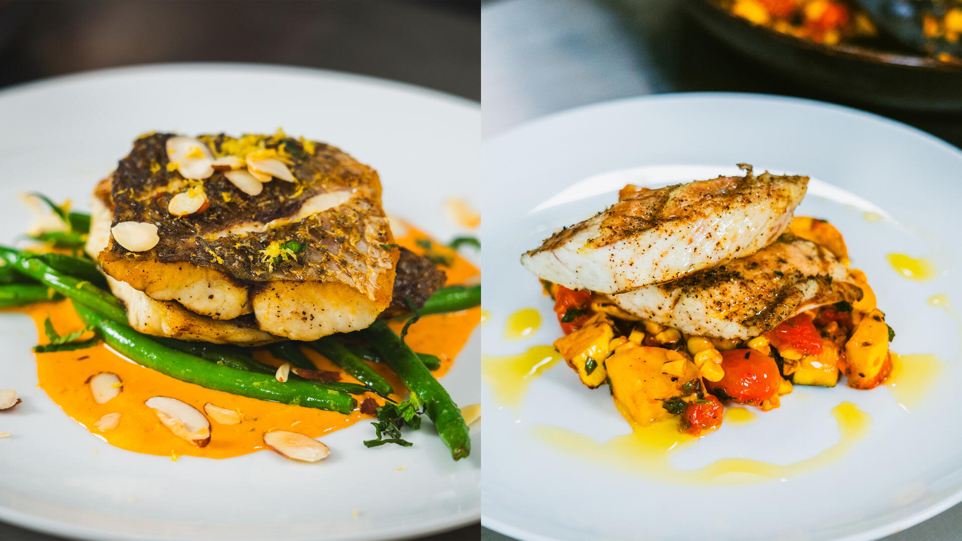Two plated redfish fillets with green beans, roasted vegetables, and almond garnish on white dishes