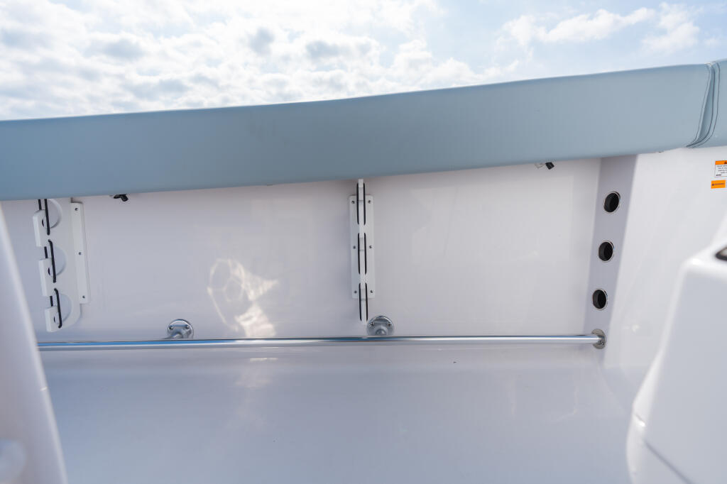 Under-gunwale rod racks with stainless steel rail on center console boat