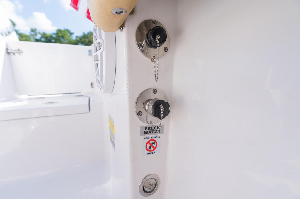 Boat freshwater washdown system with dual pull-chain controls and non-potable water warning label