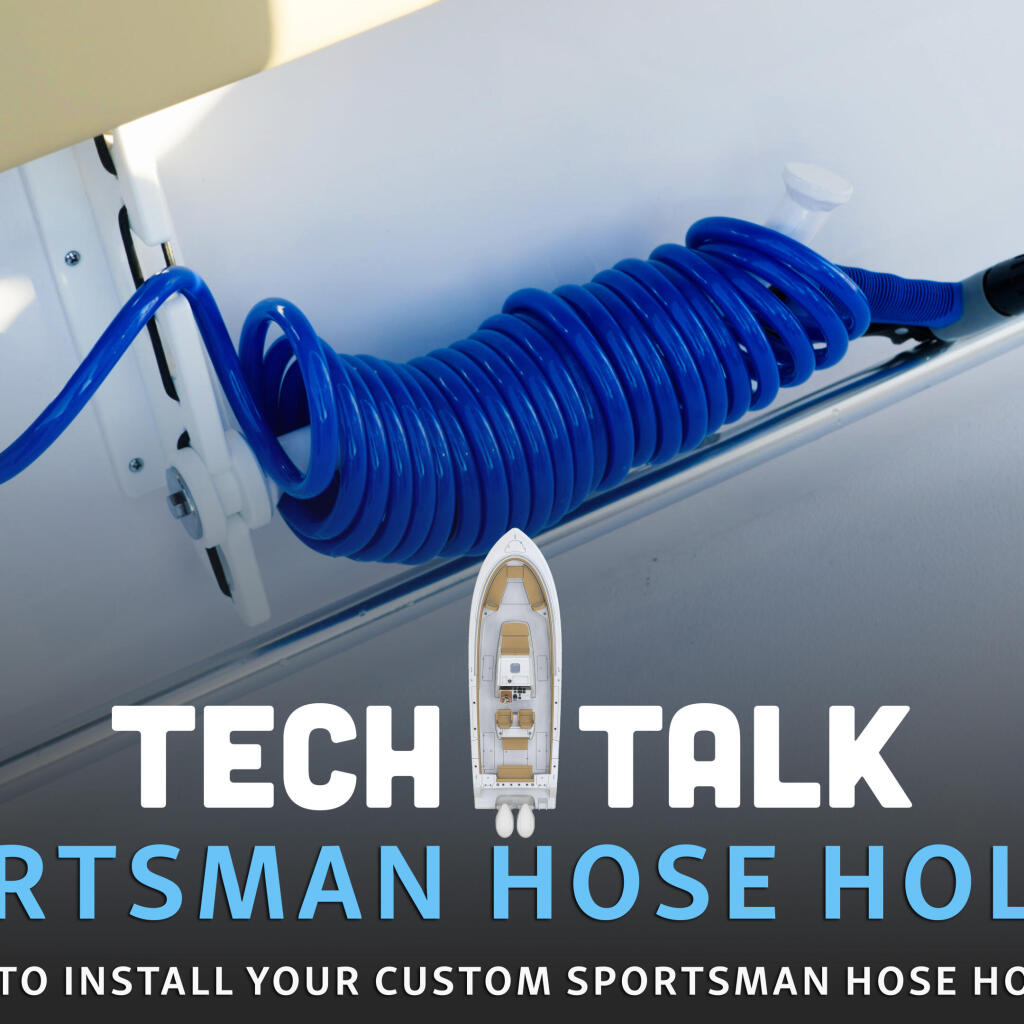 Blue coiled hose holder mounted on white boat gunwale with storage compartment