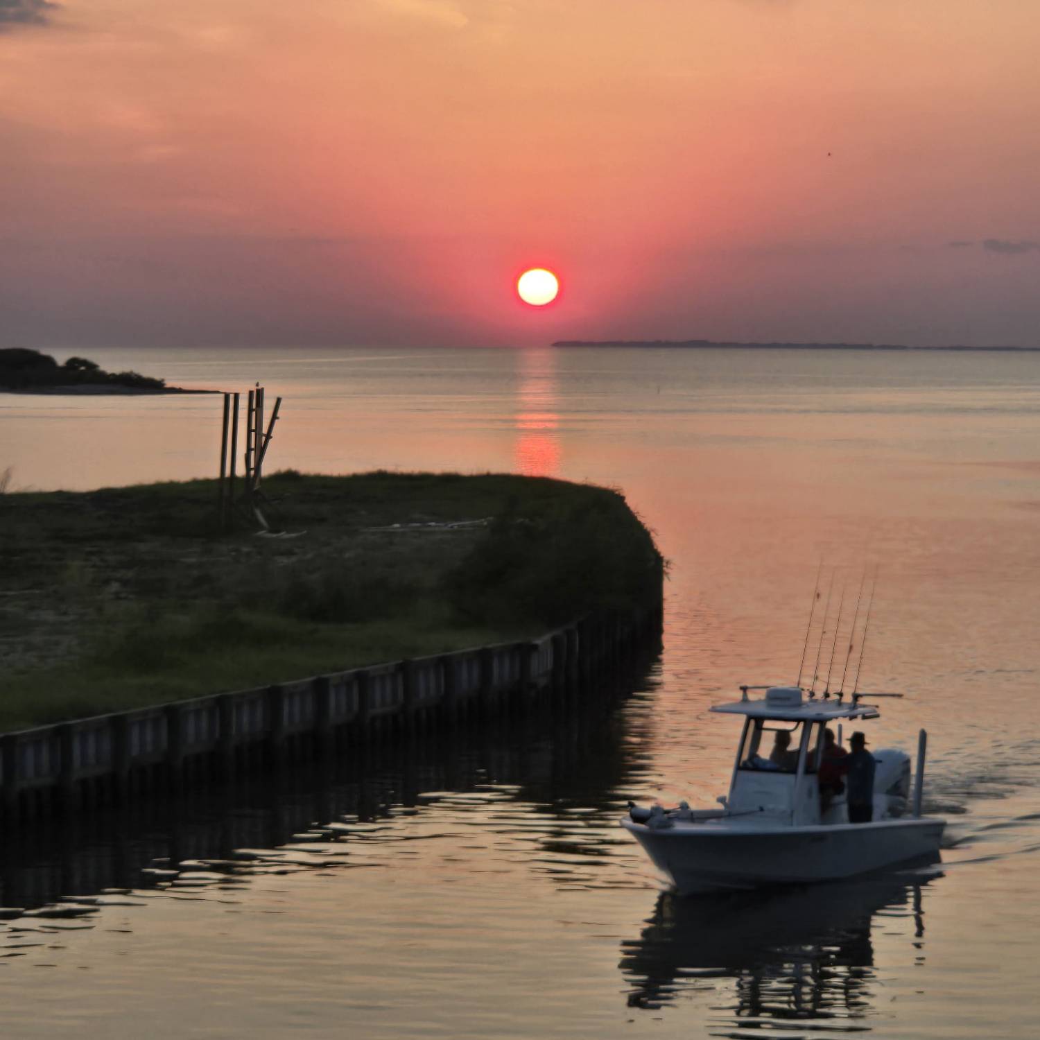 Coming home after a long day of fishing at sunset. Thanks to our neighbor who captured this picture!