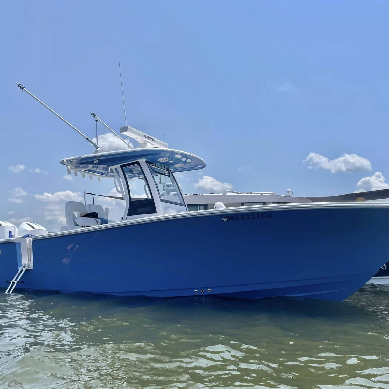 Title: Getting some rays at the Conquest Beach Maryland - On board their Sportsman Open 262 Center Console - Location: Maryland. Participating in the Photo Contest #SportsmanSeptember2024