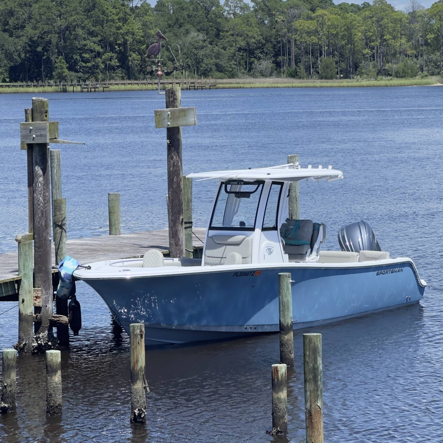 Title: Docked at Boondocks restaurant - On board their Sportsman Heritage 231 Center Console - Location: West Bay, Bay County Florida. Participating in the Photo Contest #SportsmanAugust2025