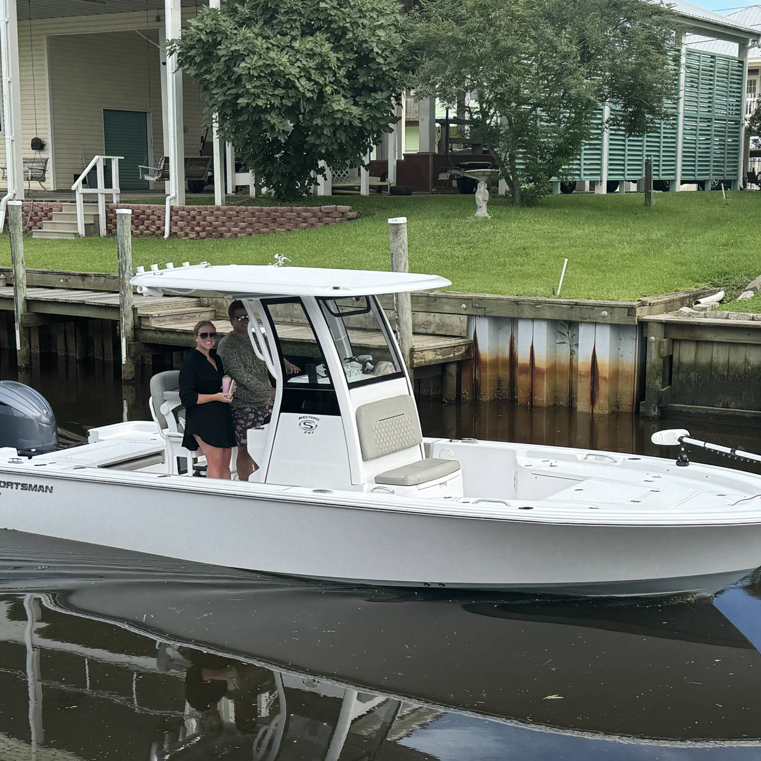 Title: Kids love driving it! - On board their Sportsman Masters 247 Bay Boat - Location: Bay St. Louis MS. Participating in the Photo Contest #SportsmanAugust2025