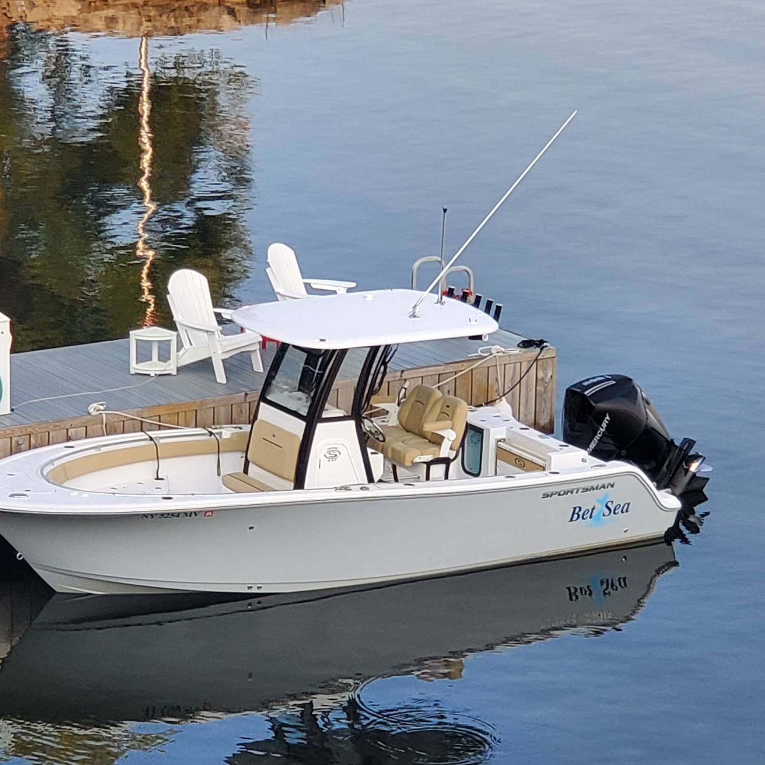 Title: RESTING AT THE DOCK - On board their Sportsman Open 232 Center Console - Location: SACKETS HARBOR NY. Participating in the Photo Contest #SportsmanSeptember2025