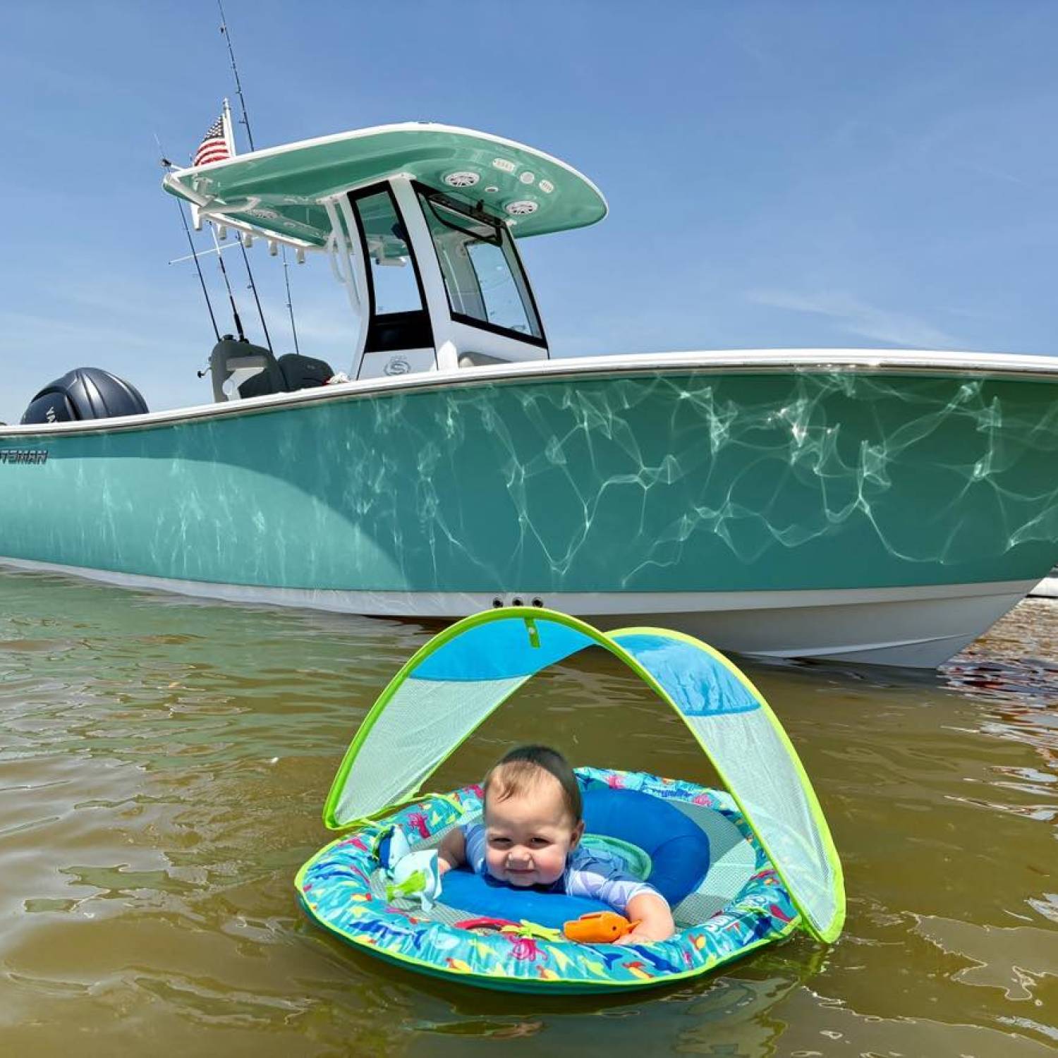 Title: Carter Wade Jarrell 8 months old - On board their Sportsman Open 232 Center Console - Location: New Smyrna Beach. Participating in the Photo Contest #SportsmanJune2025