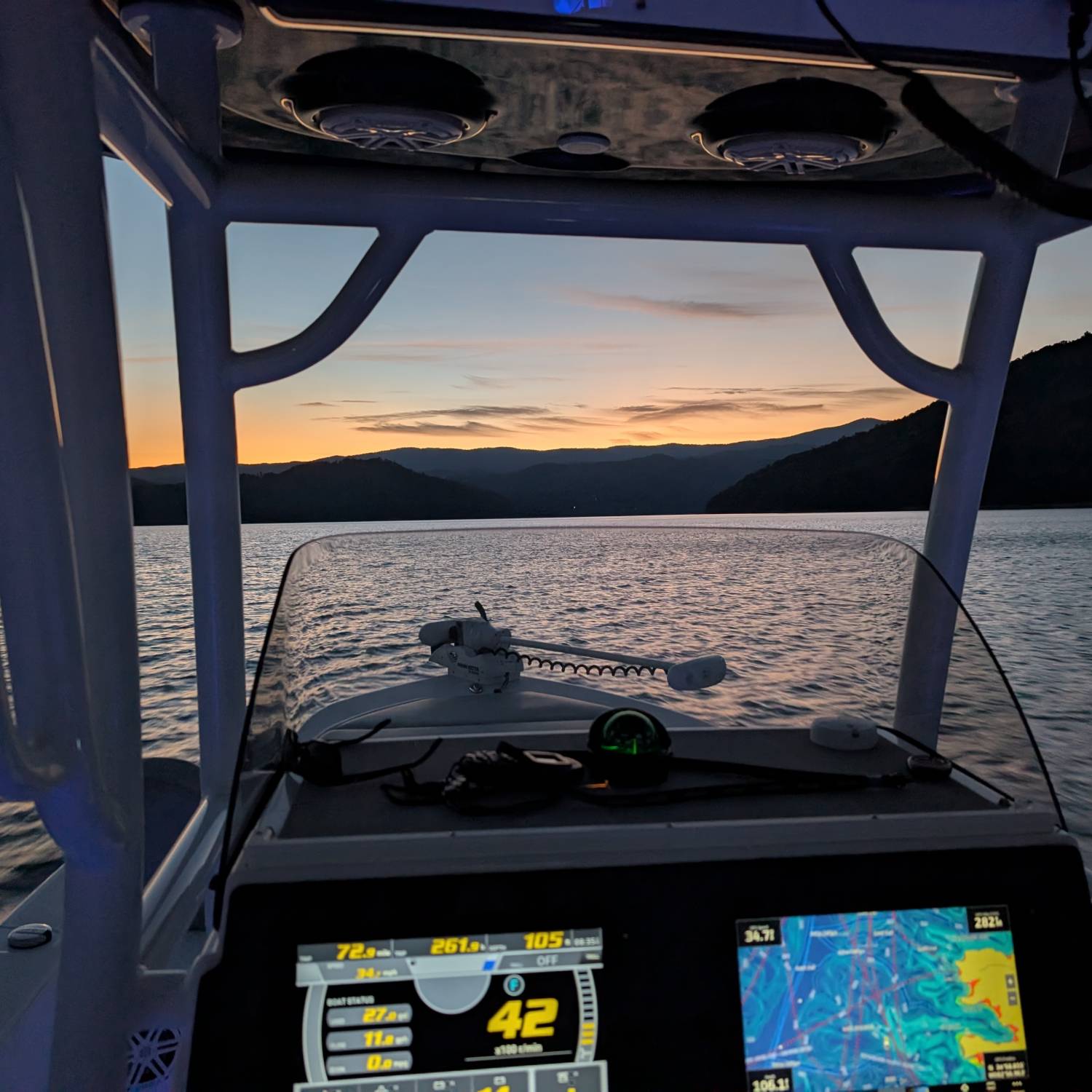 Cruising at sunset on lake Jocassee to the waterfalls in the back
